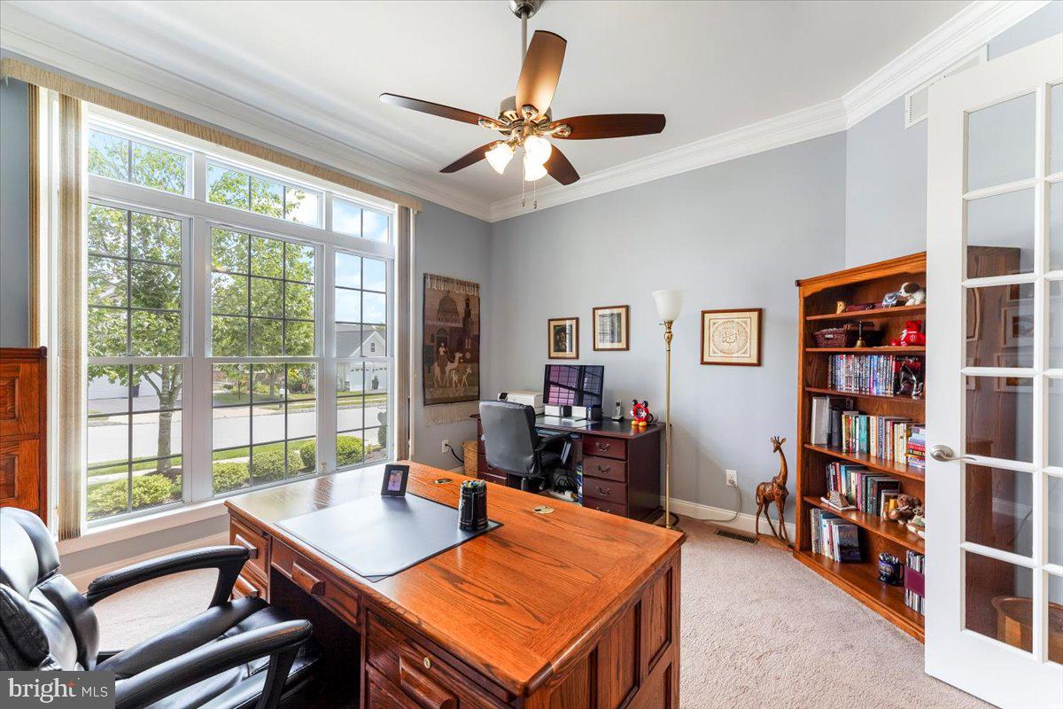515 Logan Road Phoenixville, PA 19460 - Photo 4 of 40 Wall of windows, crown molding and fan