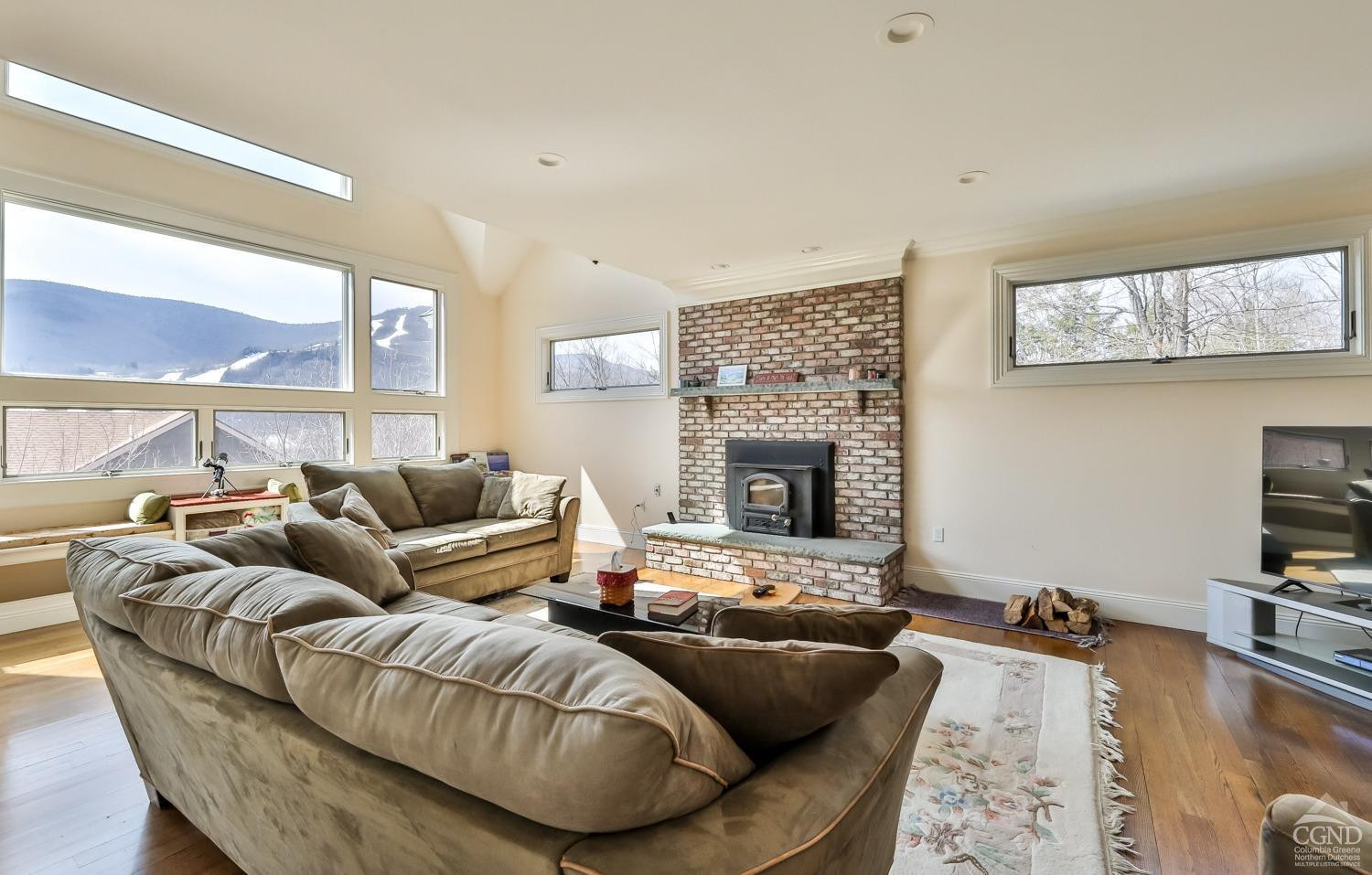 88 Gaby Road Hunter, NY 12442 - Photo 19 of 60 a living room with furniture fireplace and a large window