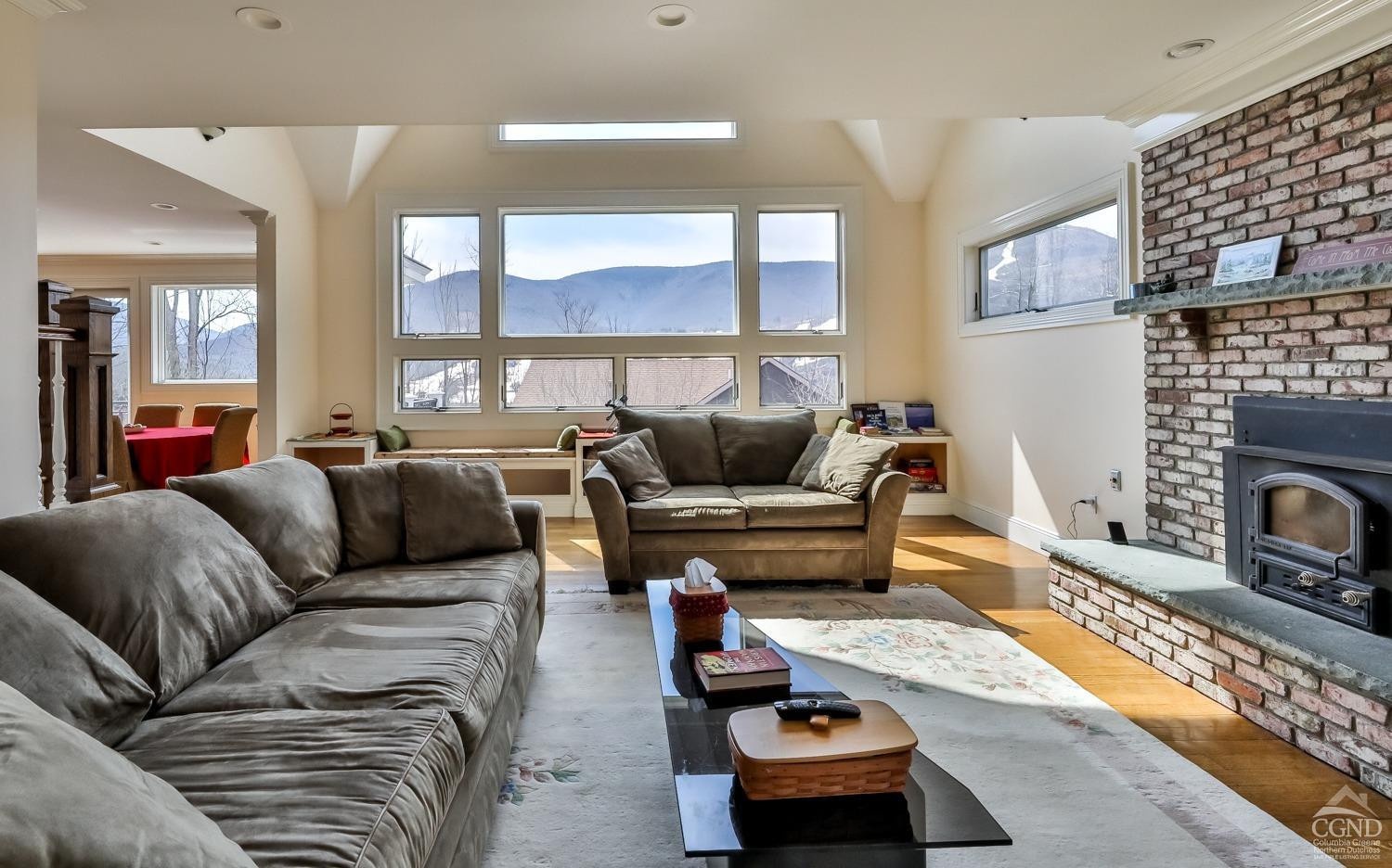 88 Gaby Road Hunter, NY 12442 - Photo 20 of 60 a living room with furniture fireplace and a table