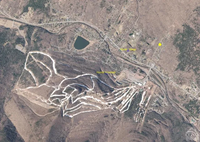 a view of house with yard in front of it