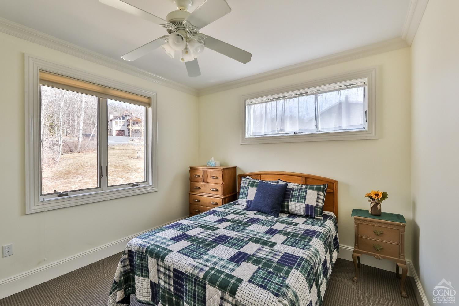 88 Gaby Road Hunter, NY 12442 - Photo 28 of 60 a bedroom with a bed and a chandelier