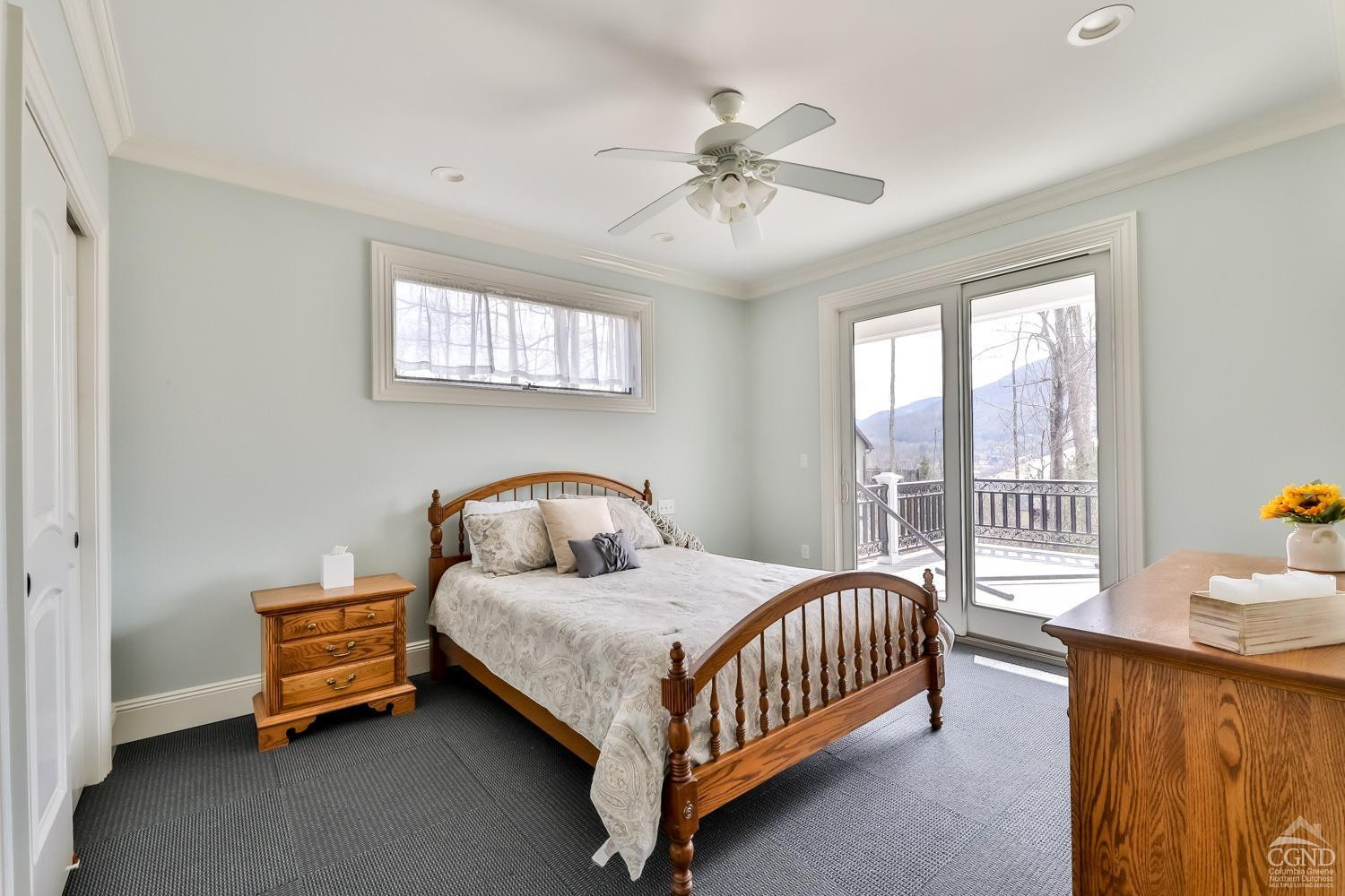 88 Gaby Road Hunter, NY 12442 - Photo 29 of 60 a bedroom with a bed a window and a chandelier