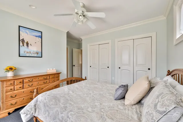 a view of a hallway with wooden floor and stairs