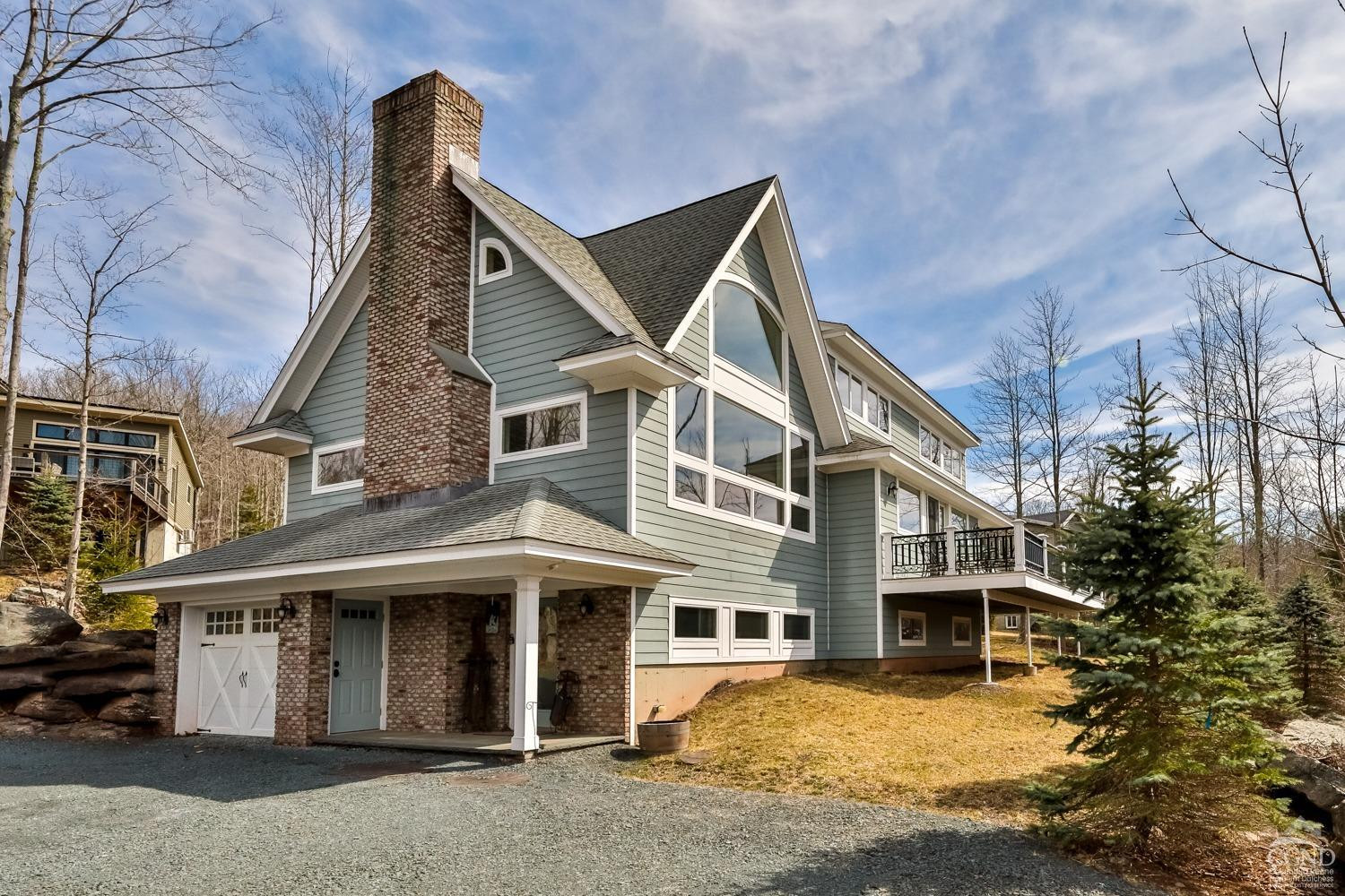 88 Gaby Road Hunter, NY 12442 - Photo 4 of 60 a view of a white house with large windows