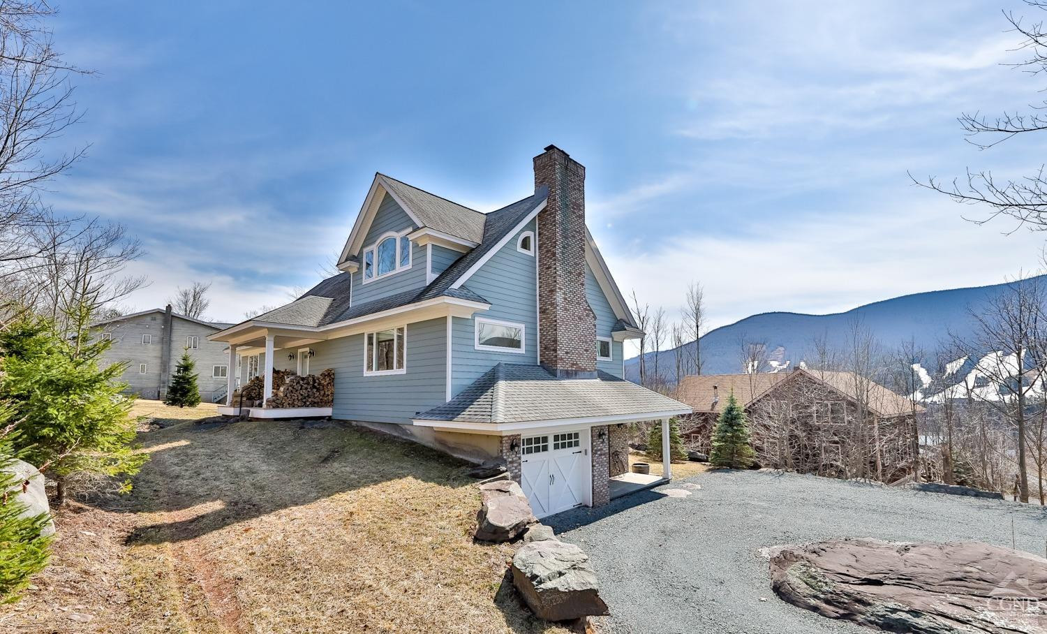 88 Gaby Road Hunter, NY 12442 - Photo 53 of 60 a front view of a house with a yard and mountain view