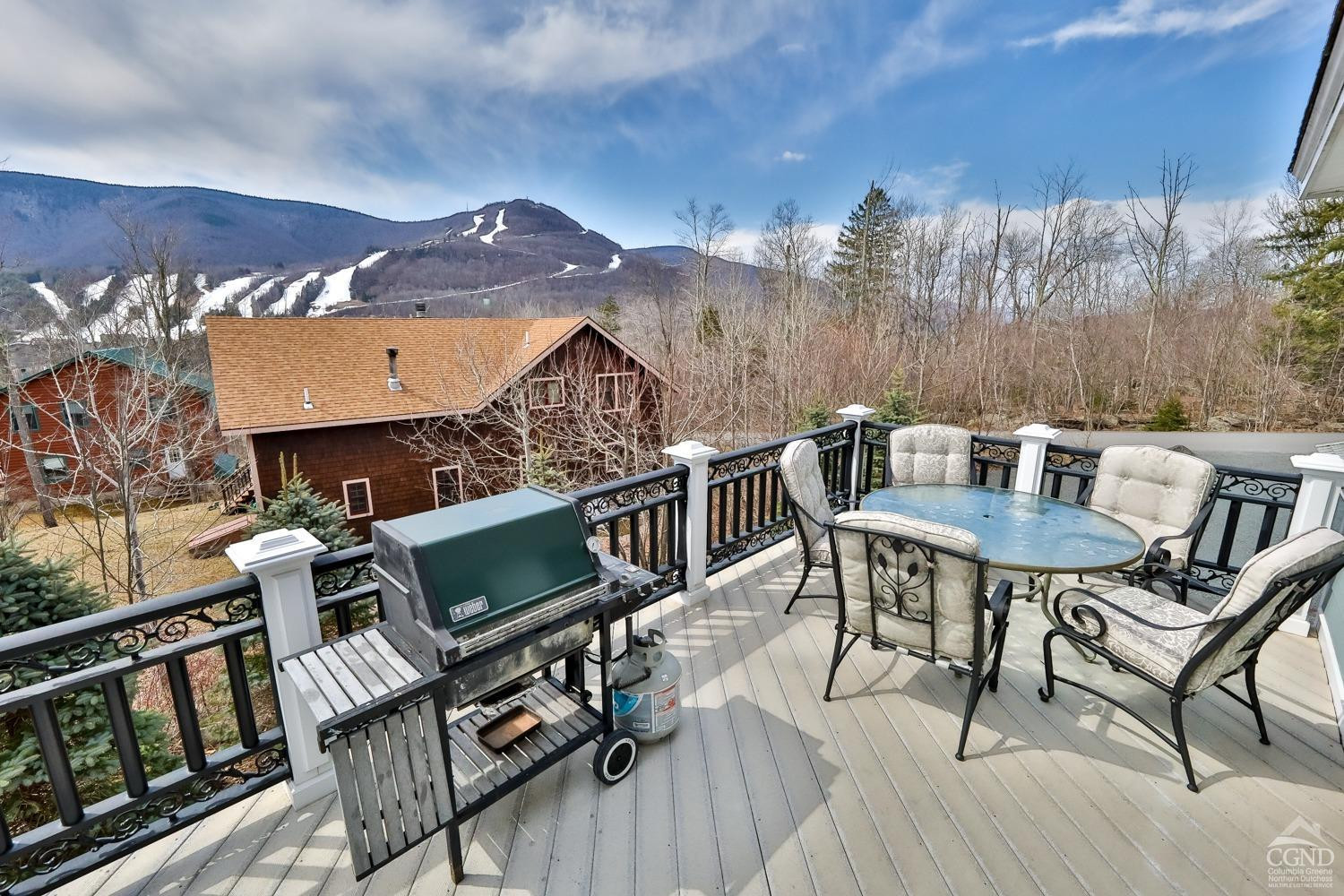 88 Gaby Road Hunter, NY 12442 - Photo 8 of 60 a view of a patio with table and chairs with wooden floor and fence