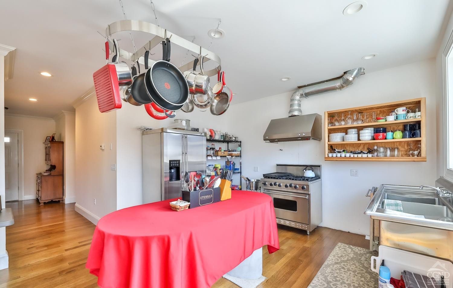 88 Gaby Road Hunter, NY 12442 - Photo 10 of 60 a kitchen with stainless steel appliances granite countertop a stove a sink and a dining table with wooden floor