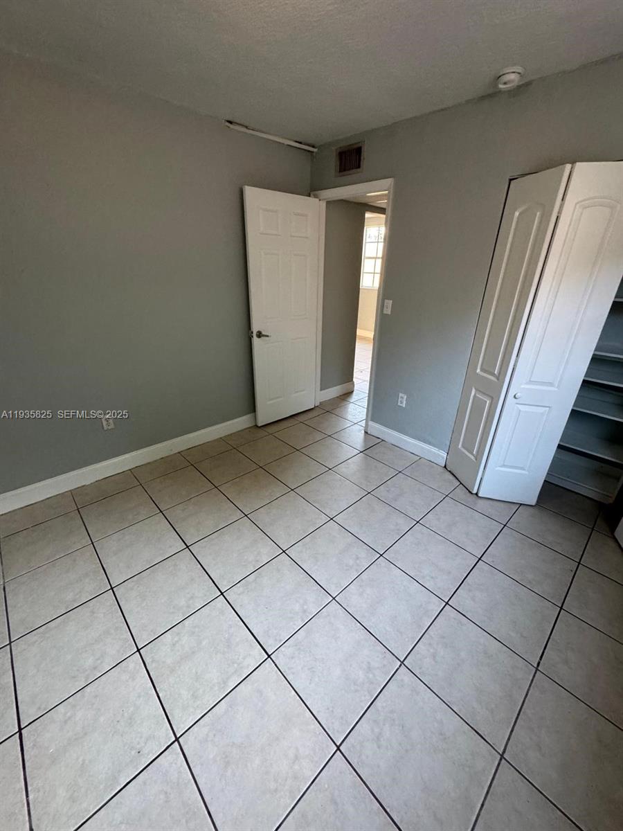 652 Northwest 3rd Street, Unit 104 Miami, FL 33128 - Photo 3 of 15 a view of a livingroom and window