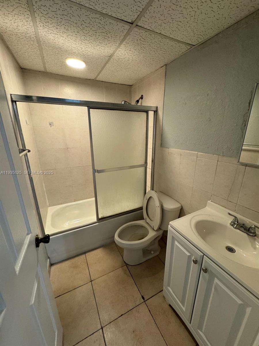652 Northwest 3rd Street, Unit 104 Miami, FL 33128 - Photo 8 of 15 a bathroom with a sink and a shower