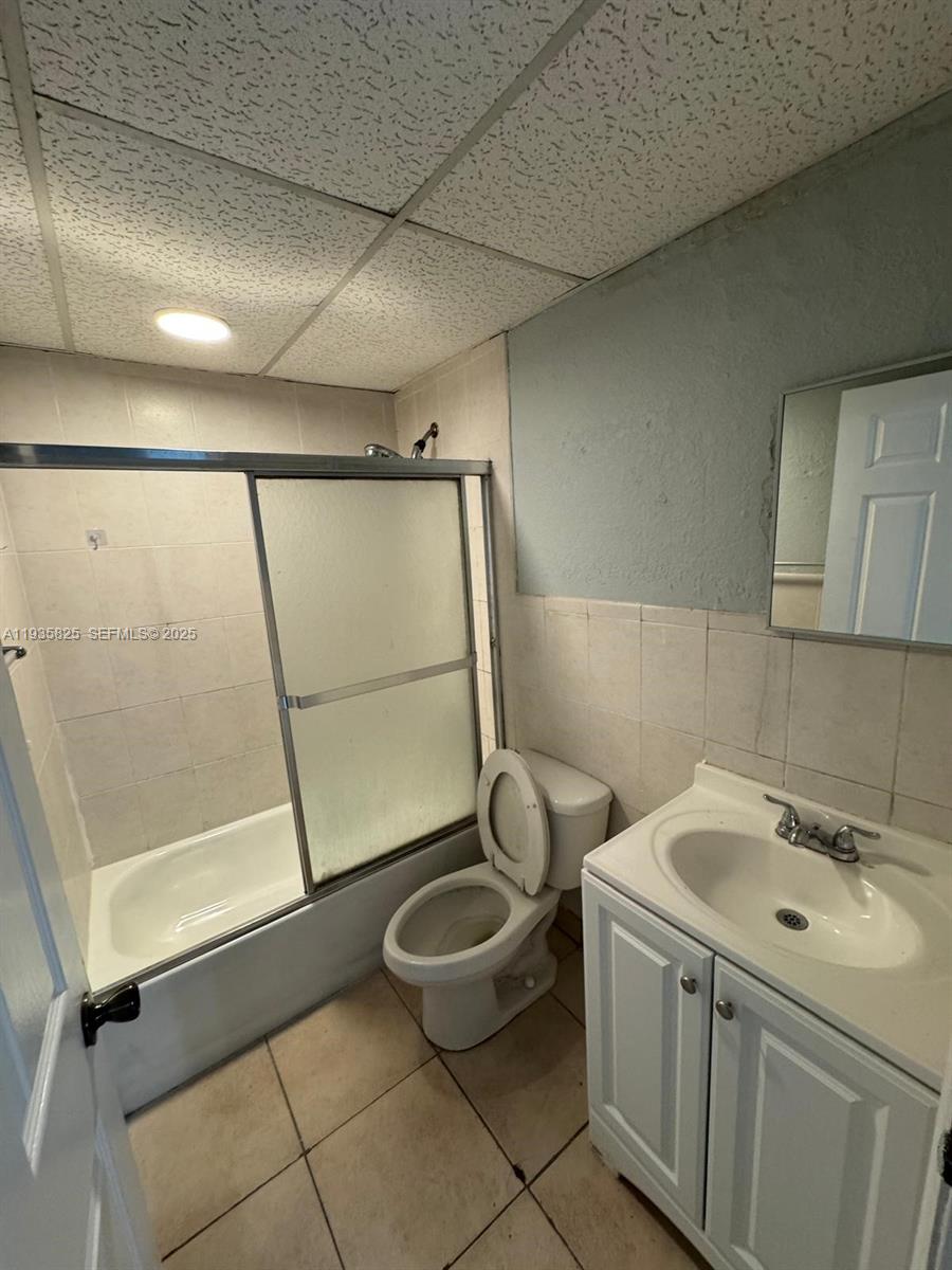652 Northwest 3rd Street, Unit 104 Miami, FL 33128 - Photo 10 of 15 a bathroom with a sink toilet and shower