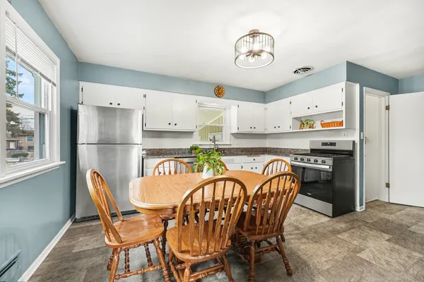 a table and chairs in a kitchen