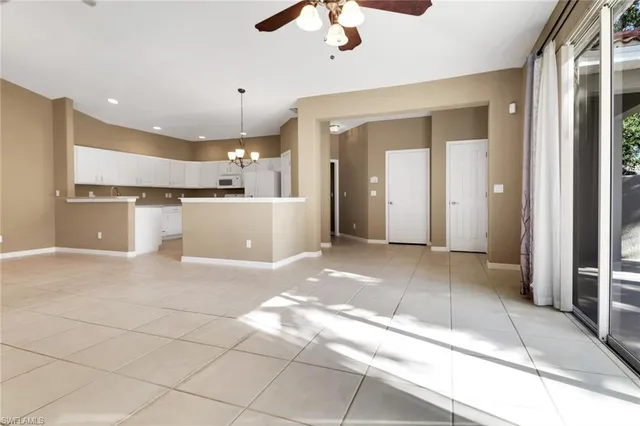 a living room with furniture a chandelier and a chandelier