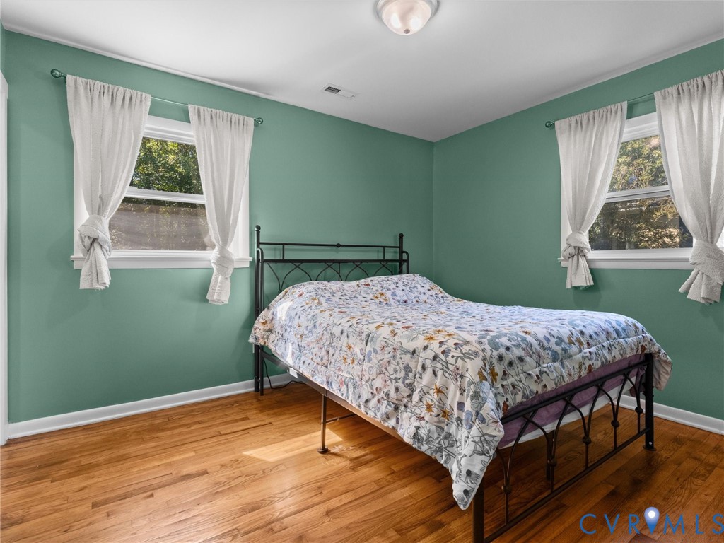 408 Howerton Road Tappahannock, VA 22560 - Photo 23 of 49 Wood-finish flooring, two windows with white trim,