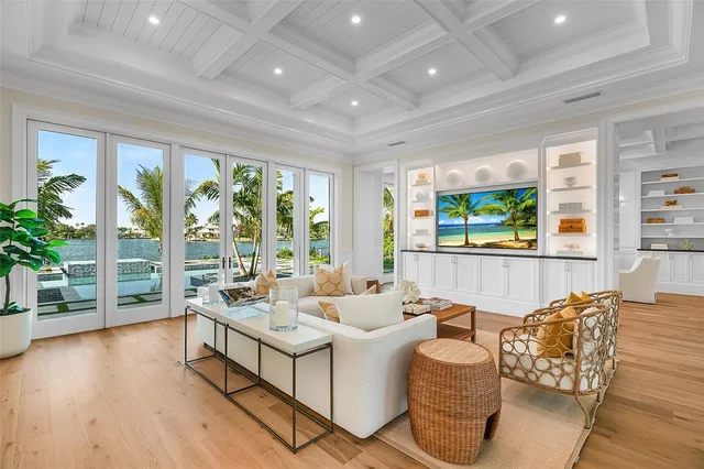 a kitchen with stainless steel appliances granite countertop a sink a stove and a wooden floor