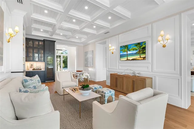 an aerial view of a house with a garden and lake view