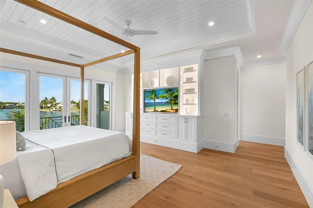 a spacious bathroom with a tub sink and mirror