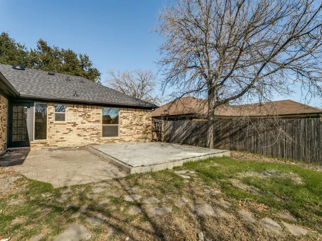 a house view with a backyard space