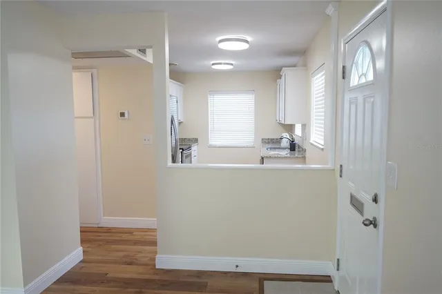 a bathroom with a sink a mirror and a window