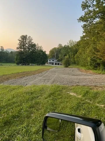 a view of a yard with an outdoor space