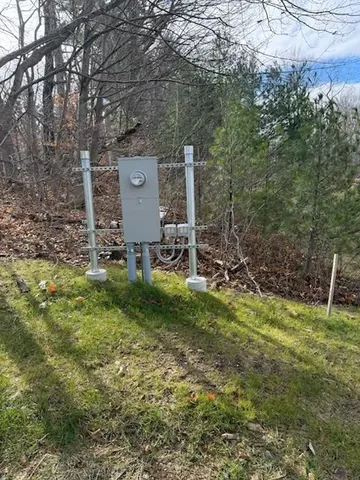 a view of a chairs in a backyard