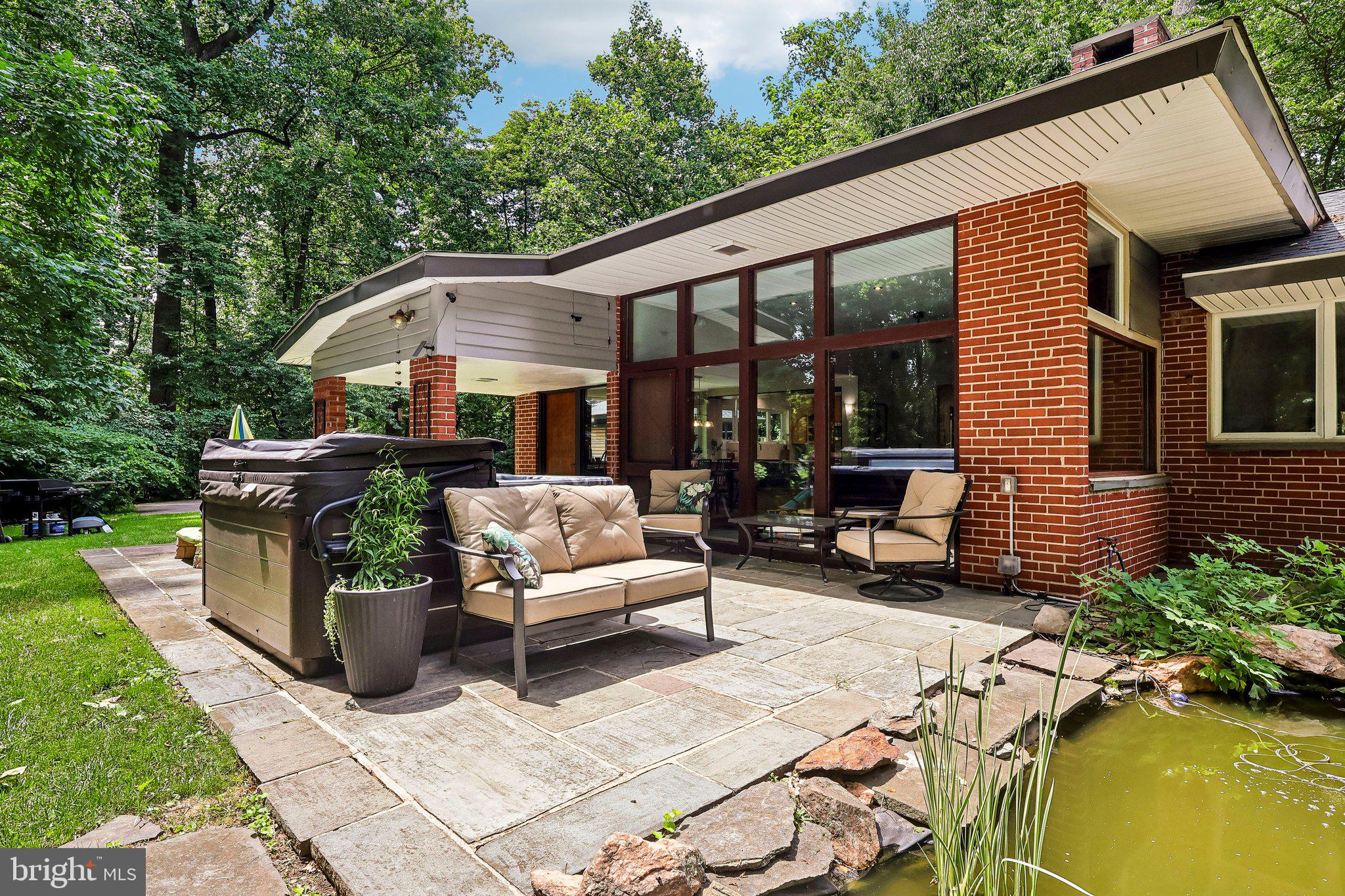 939 North Avenue Springfield, PA 19064 - Photo 4 of 49 Private back patio w/ Koi fish pond.