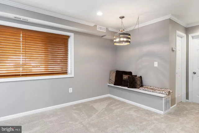 a view of a livingroom with a ceiling fan and window