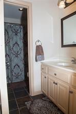 4122 West Crescent Way Frisco, TX 75034 - Photo 16 of 20 a bathroom with a shower and a sink