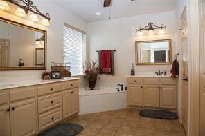 4122 West Crescent Way Frisco, TX 75034 - Photo 8 of 20 a bathroom with a double vanity sink mirror and bathtub