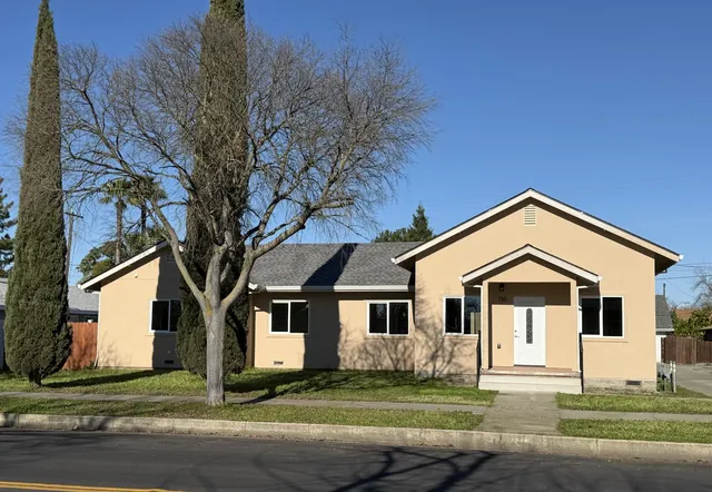 a front view of a house with a yard