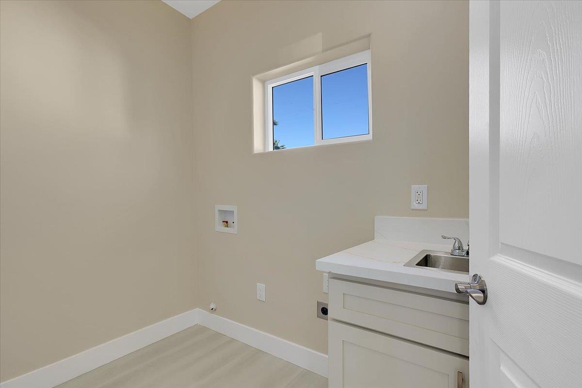 130 Fremont Street Colusa, CA 95932 - Photo 29 of 39 a bathroom with a sink and cabinets