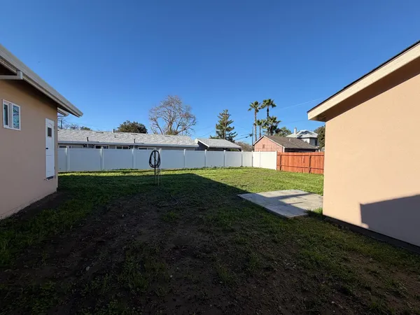 a view of a big house with a big yard