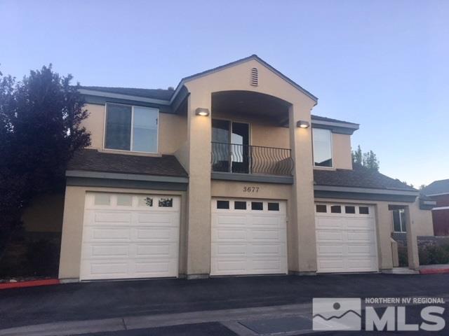 3677 A Warren Way Reno, NV 89509 - Photo 3 of 10 a front view of a house with a garage