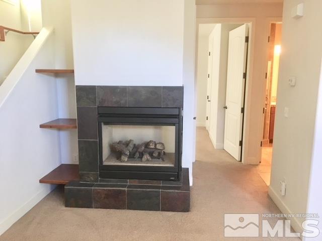 3677 A Warren Way Reno, NV 89509 - Photo 9 of 10 a living room with furniture and a fireplace