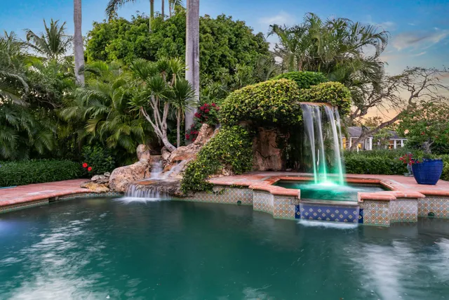 an aerial view of a residential houses with street