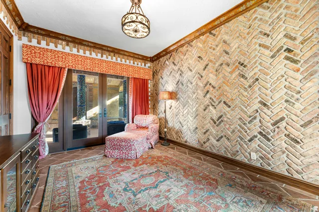 a living room filled with furniture and a chandelier