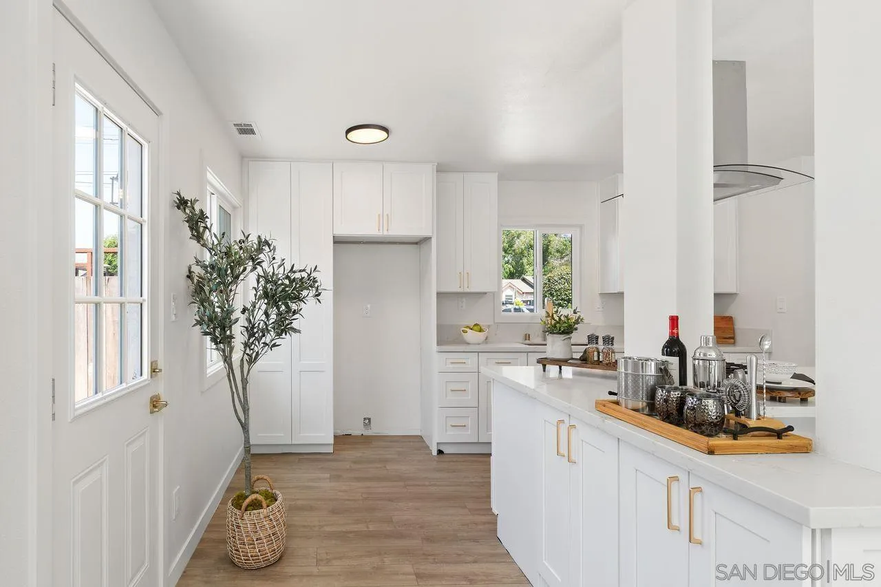 12914 Morene Street Poway, CA 92064 - Photo 12 of 40 a kitchen with a sink stove and refrigerator