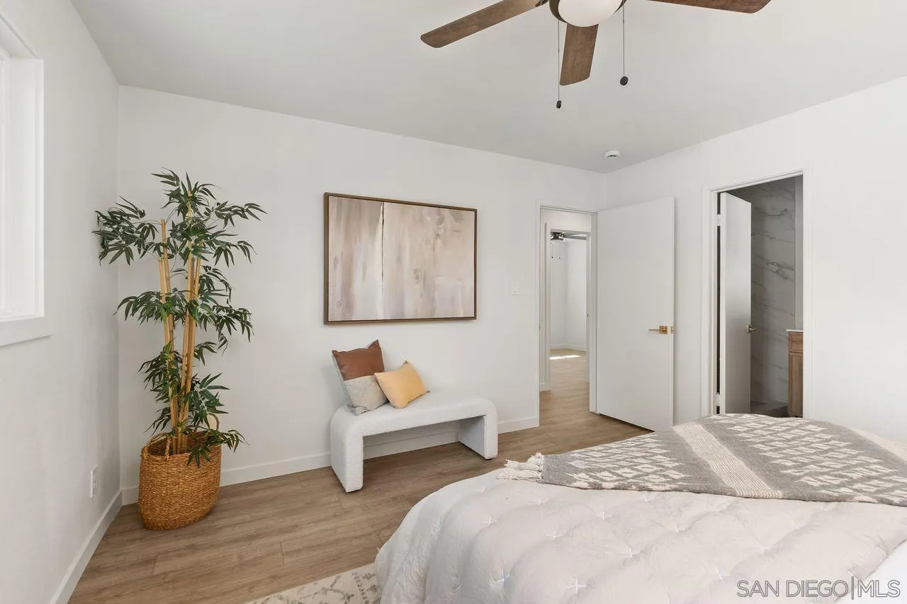 12914 Morene Street Poway, CA 92064 - Photo 18 of 40 a bedroom with bed and a potted plant
