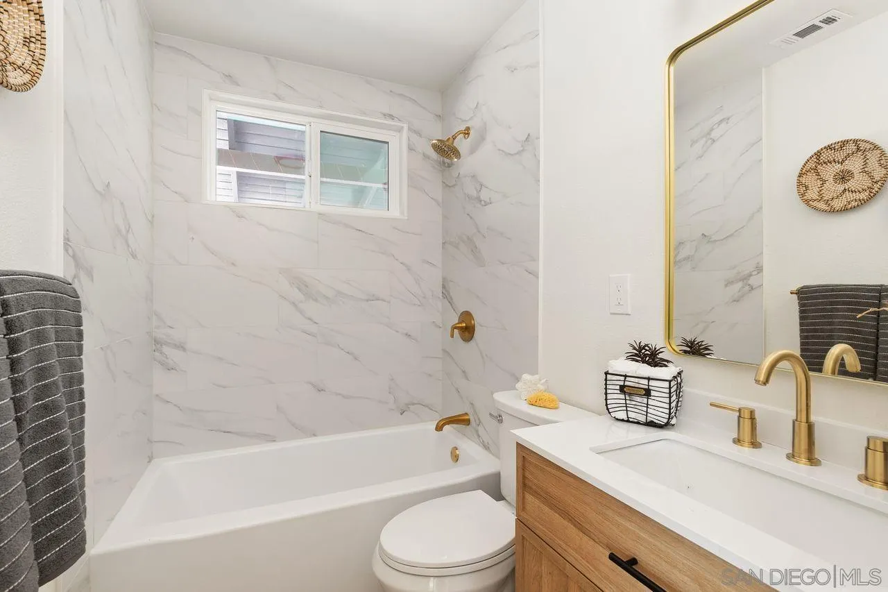 12914 Morene Street Poway, CA 92064 - Photo 24 of 40 a bathroom with a sink toilet and shower