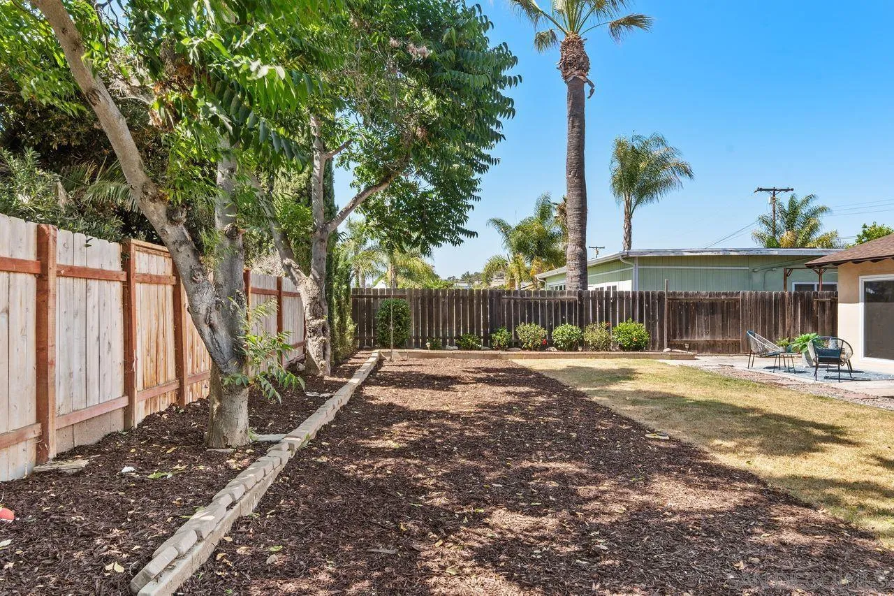 12914 Morene Street Poway, CA 92064 - Photo 33 of 40 a view of a house with backyard and a tree
