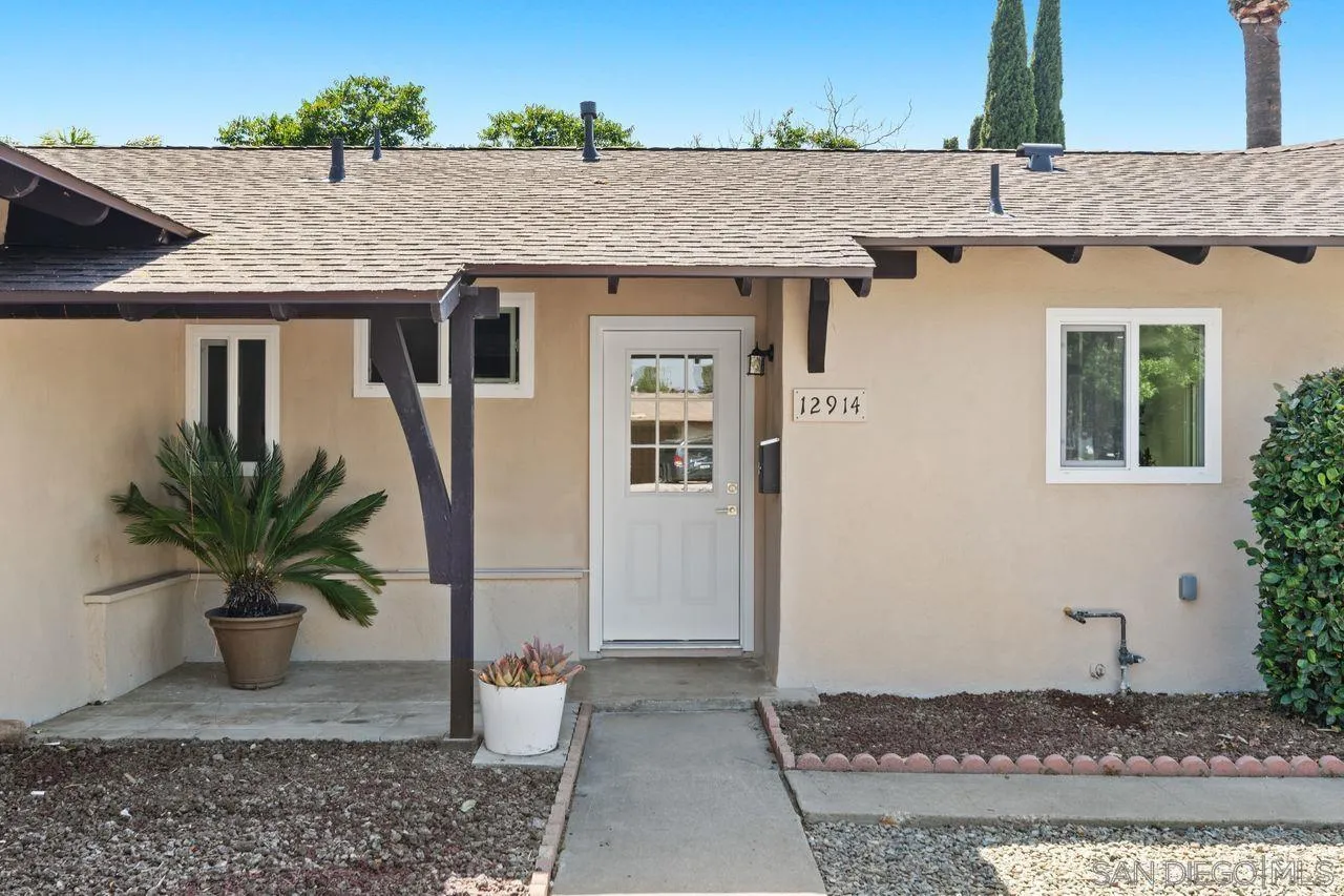 12914 Morene Street Poway, CA 92064 - Photo 40 of 40 a front view of a house with potted plants