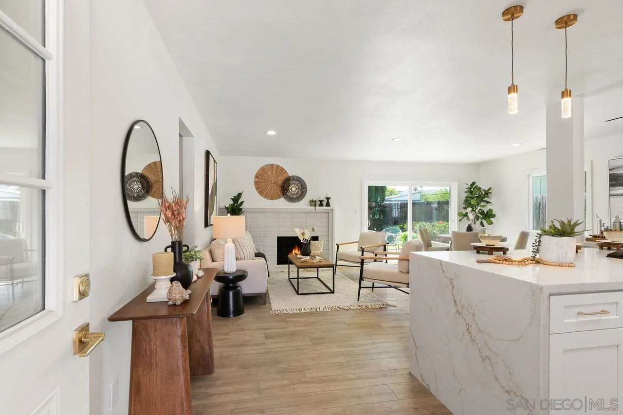 12914 Morene Street Poway, CA 92064 - Photo 5 of 40 a living room with furniture a large window and wooden floor