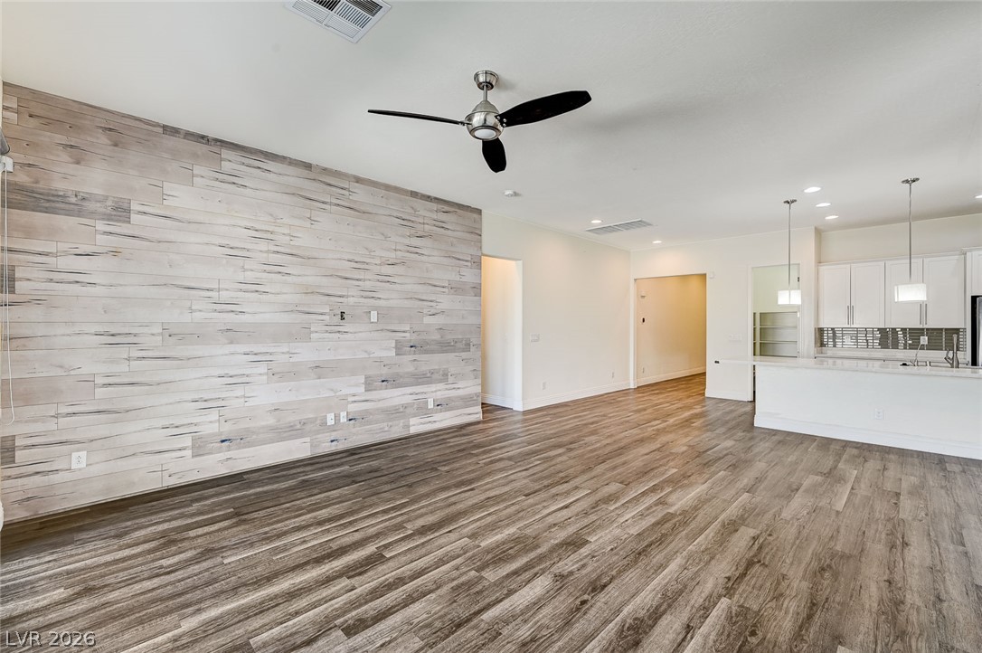 8197 Riley Love Street Las Vegas, NV 89139 - Photo 48 of 48 An open floorplan with durable flooring connects living spaces seamlessly.