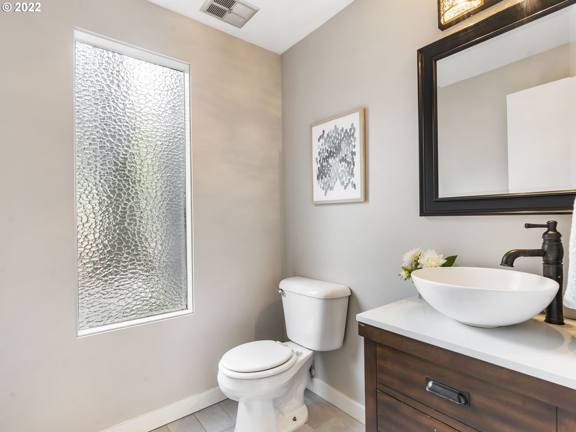 10029 Southwest 52nd Avenue Portland, OR 97219 - Photo 15 of 31 a bathroom with a toilet sink and mirror