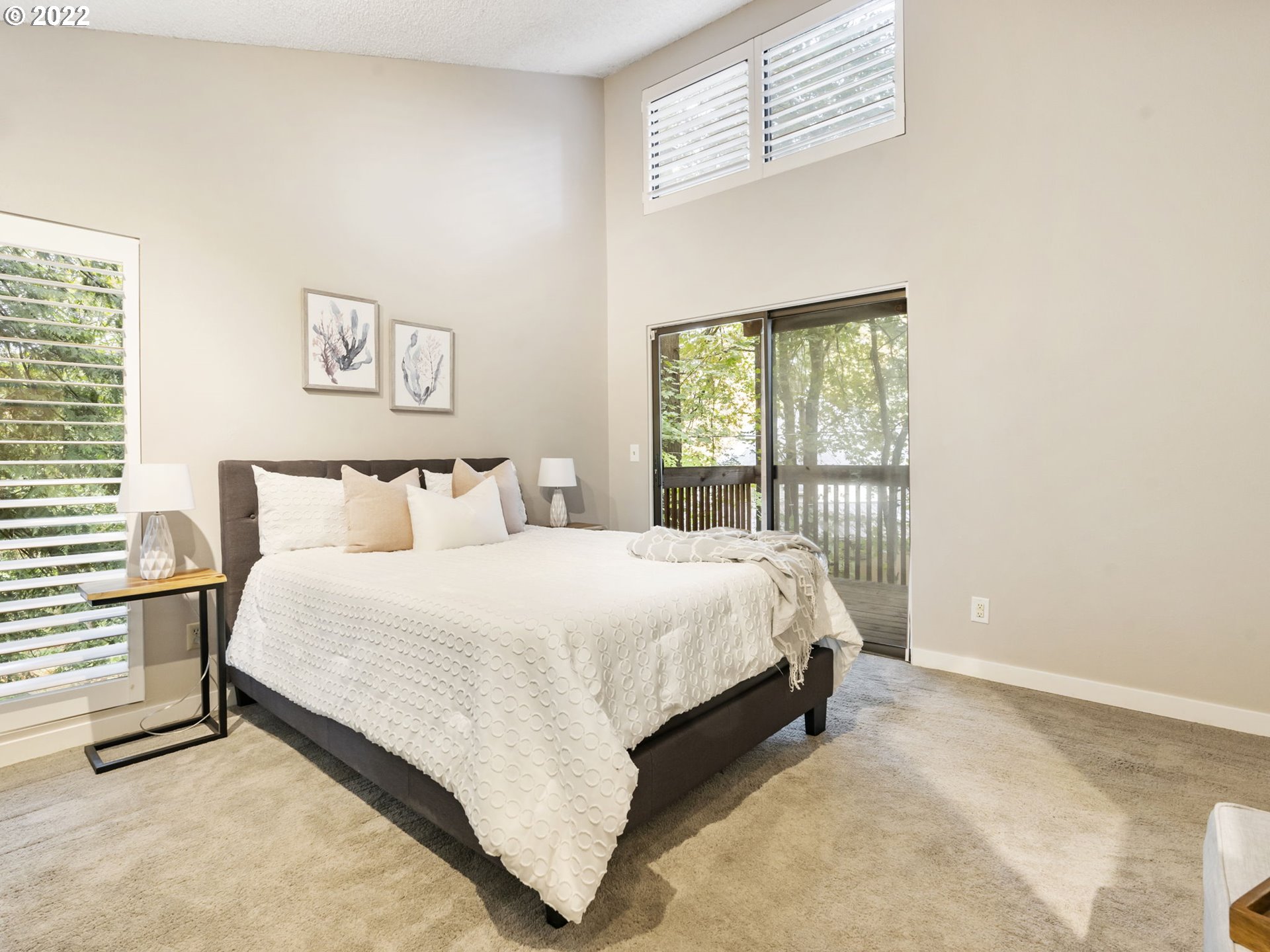 10029 Southwest 52nd Avenue Portland, OR 97219 - Photo 17 of 31 a bedroom with a bed and a window