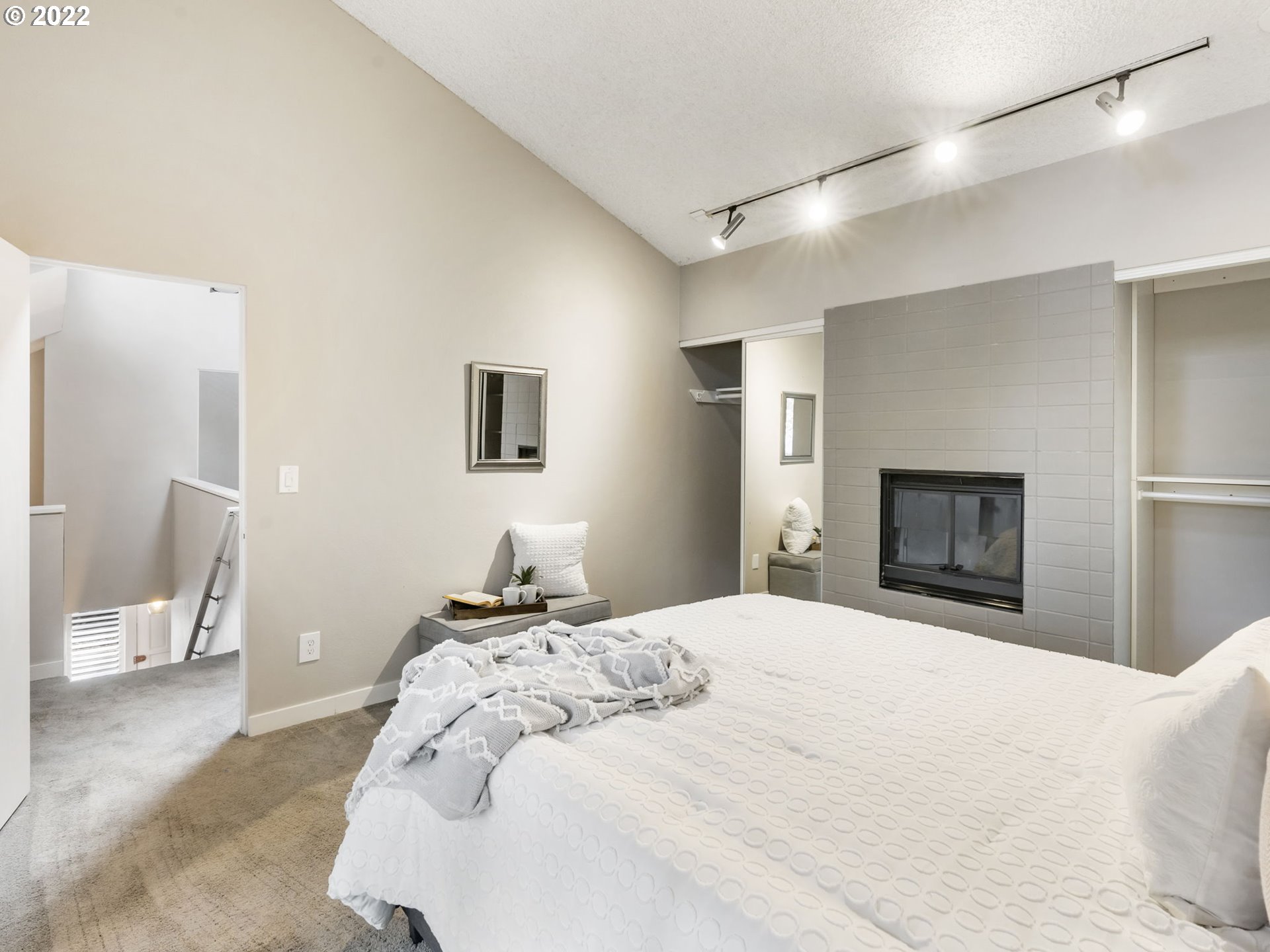 10029 Southwest 52nd Avenue Portland, OR 97219 - Photo 21 of 31 a bedroom with a bed and a television