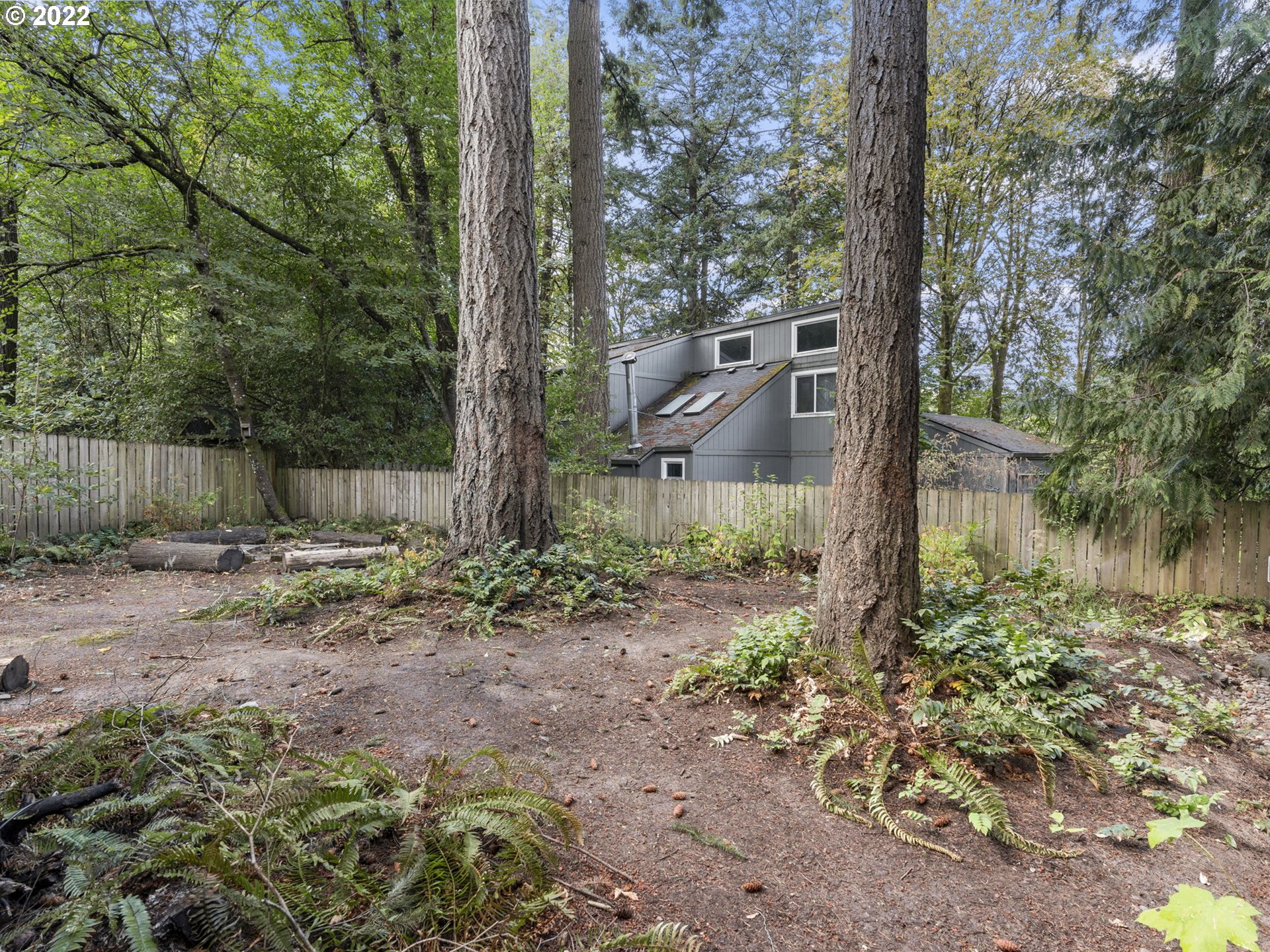 10029 Southwest 52nd Avenue Portland, OR 97219 - Photo 30 of 31 a backyard of a house with lots of green space