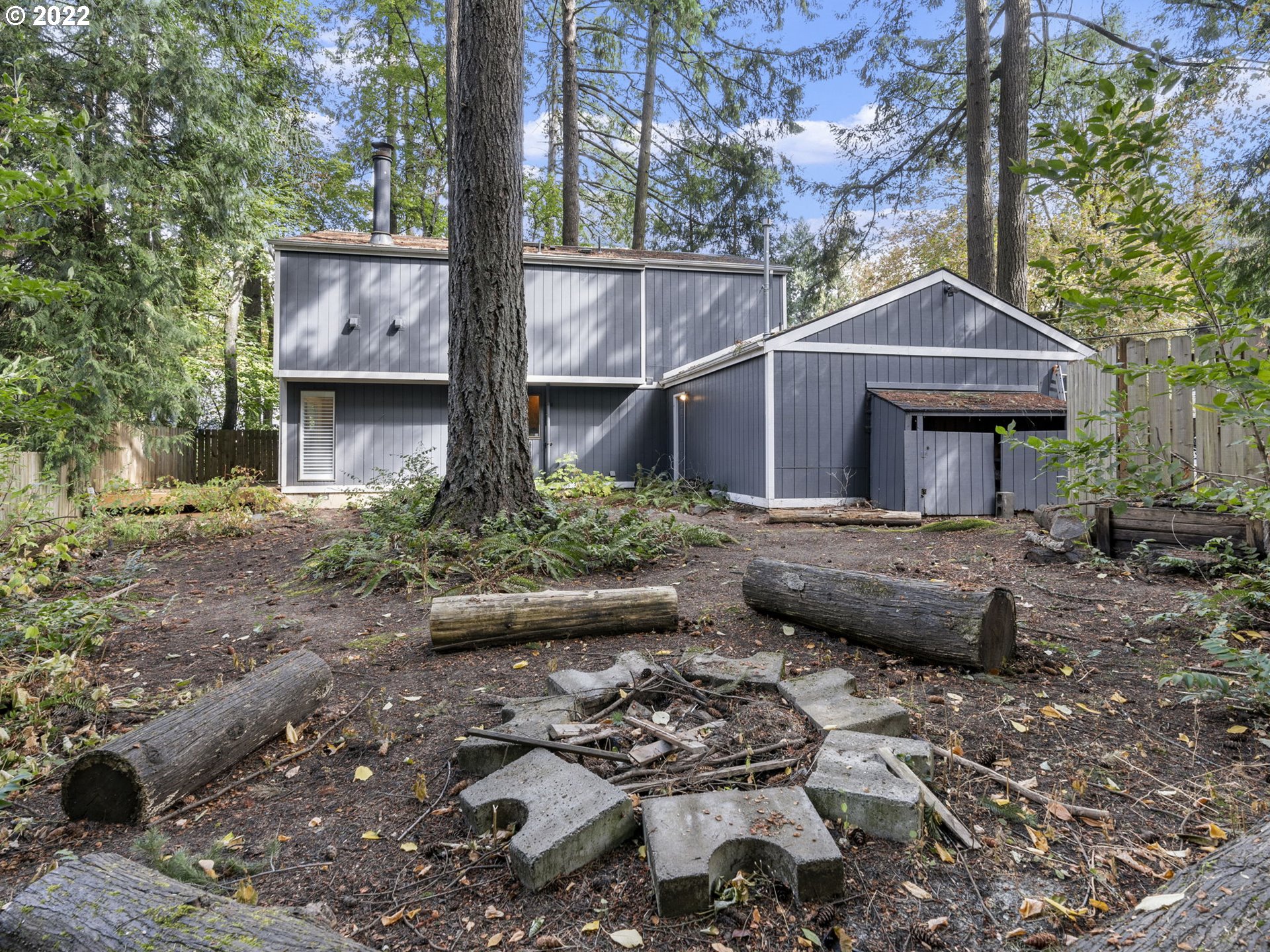 10029 Southwest 52nd Avenue Portland, OR 97219 - Photo 31 of 31 a view of house with backyard porch and sitting area