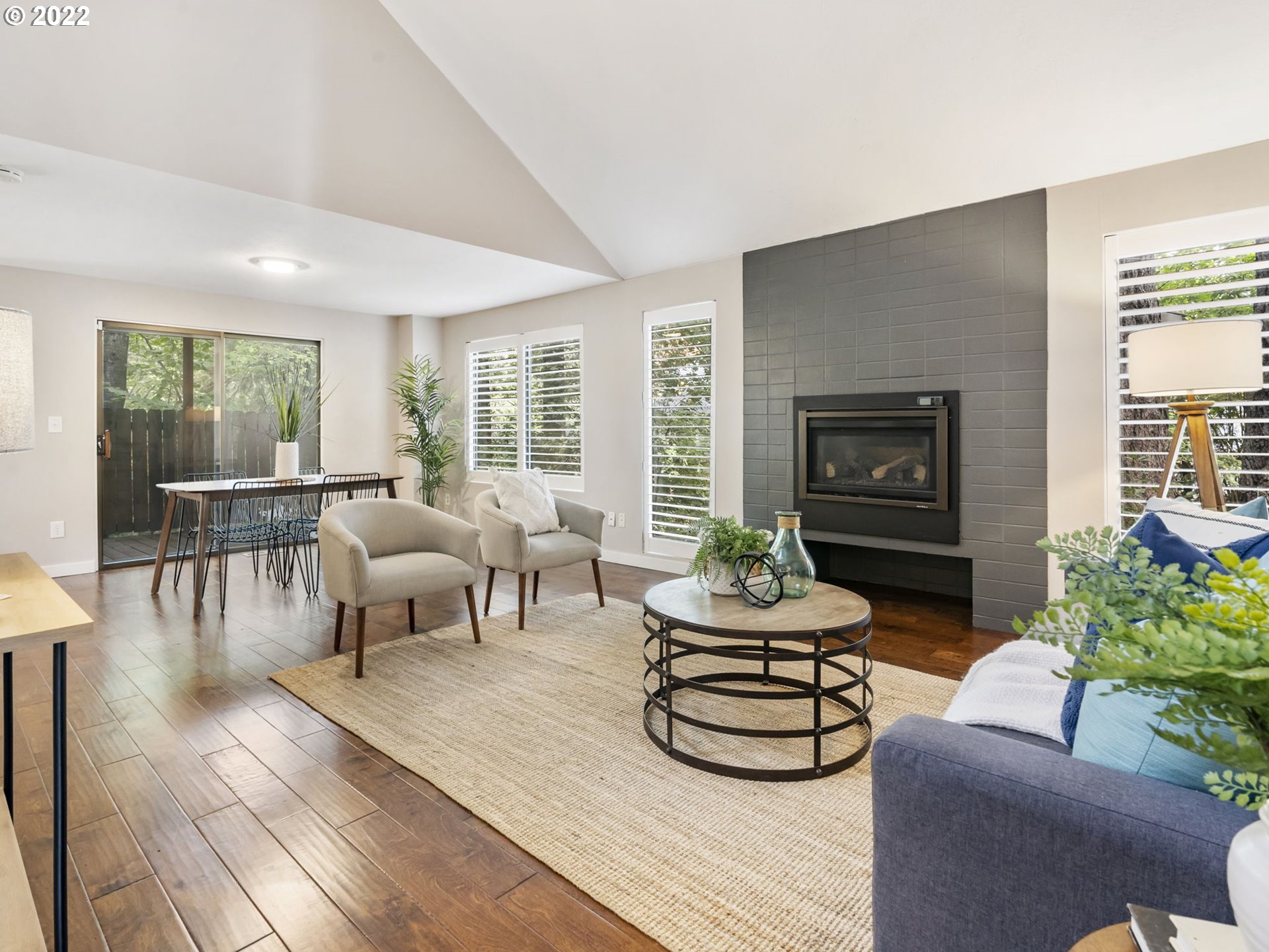 10029 Southwest 52nd Avenue Portland, OR 97219 - Photo 4 of 31 a living room with furniture and a fireplace