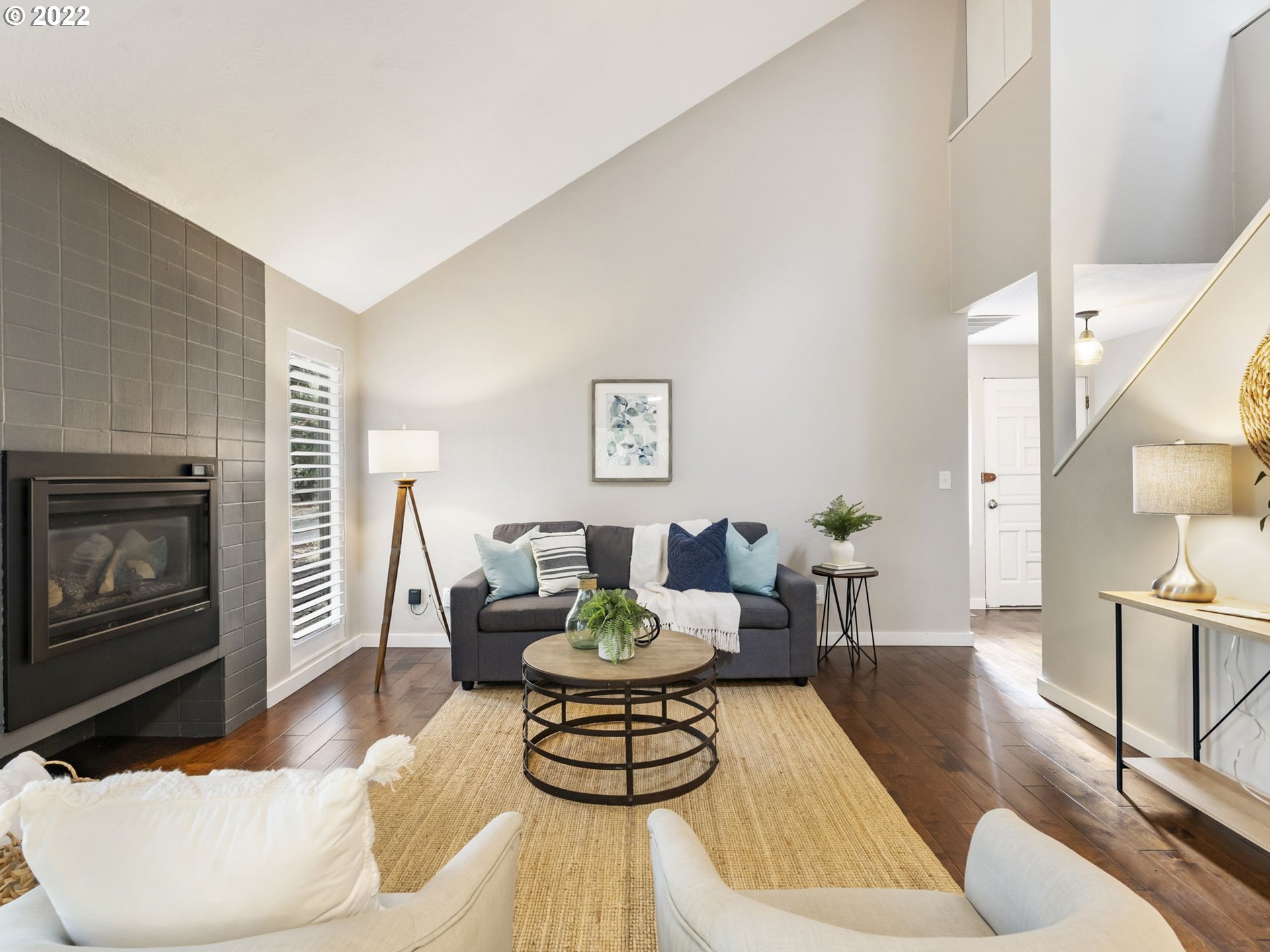 10029 Southwest 52nd Avenue Portland, OR 97219 - Photo 5 of 31 a living room with furniture and a fireplace
