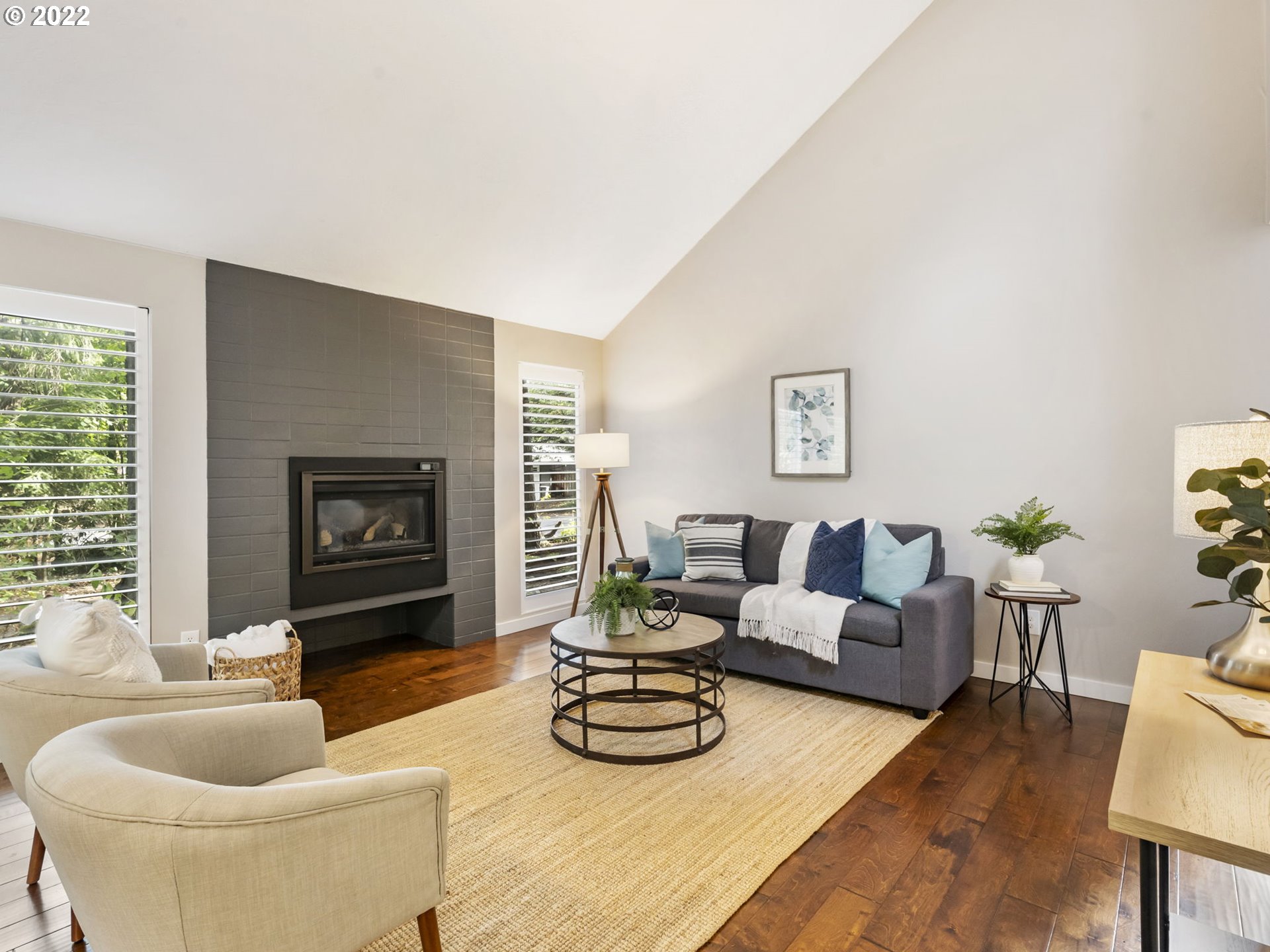 10029 Southwest 52nd Avenue Portland, OR 97219 - Photo 7 of 31 a living room with furniture and a fireplace